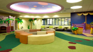 Custom printed hospital impact absorbing flooring in a children's play room.