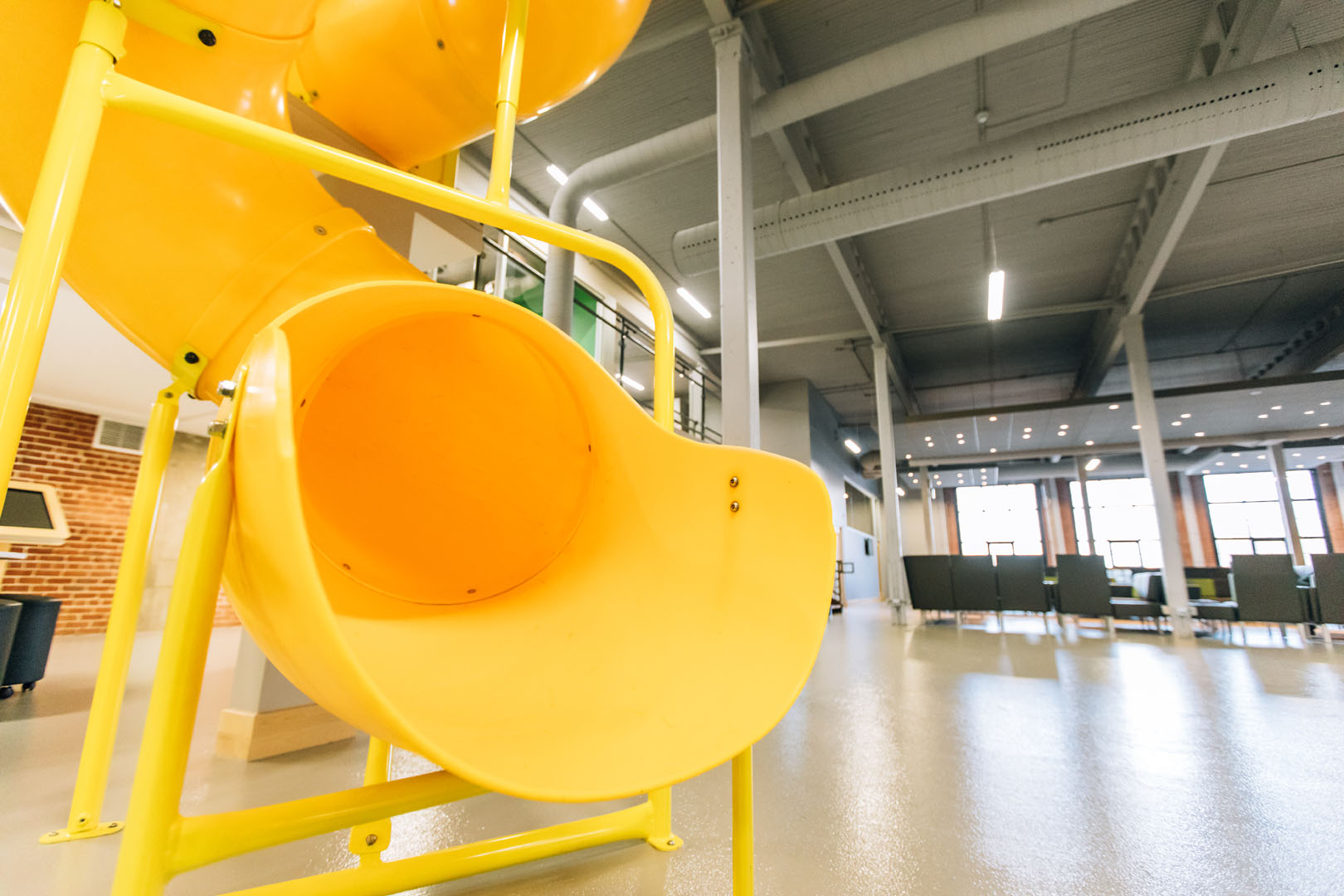 SafeLandings Flooring with a tall slide that complies with playground fall height requirements.